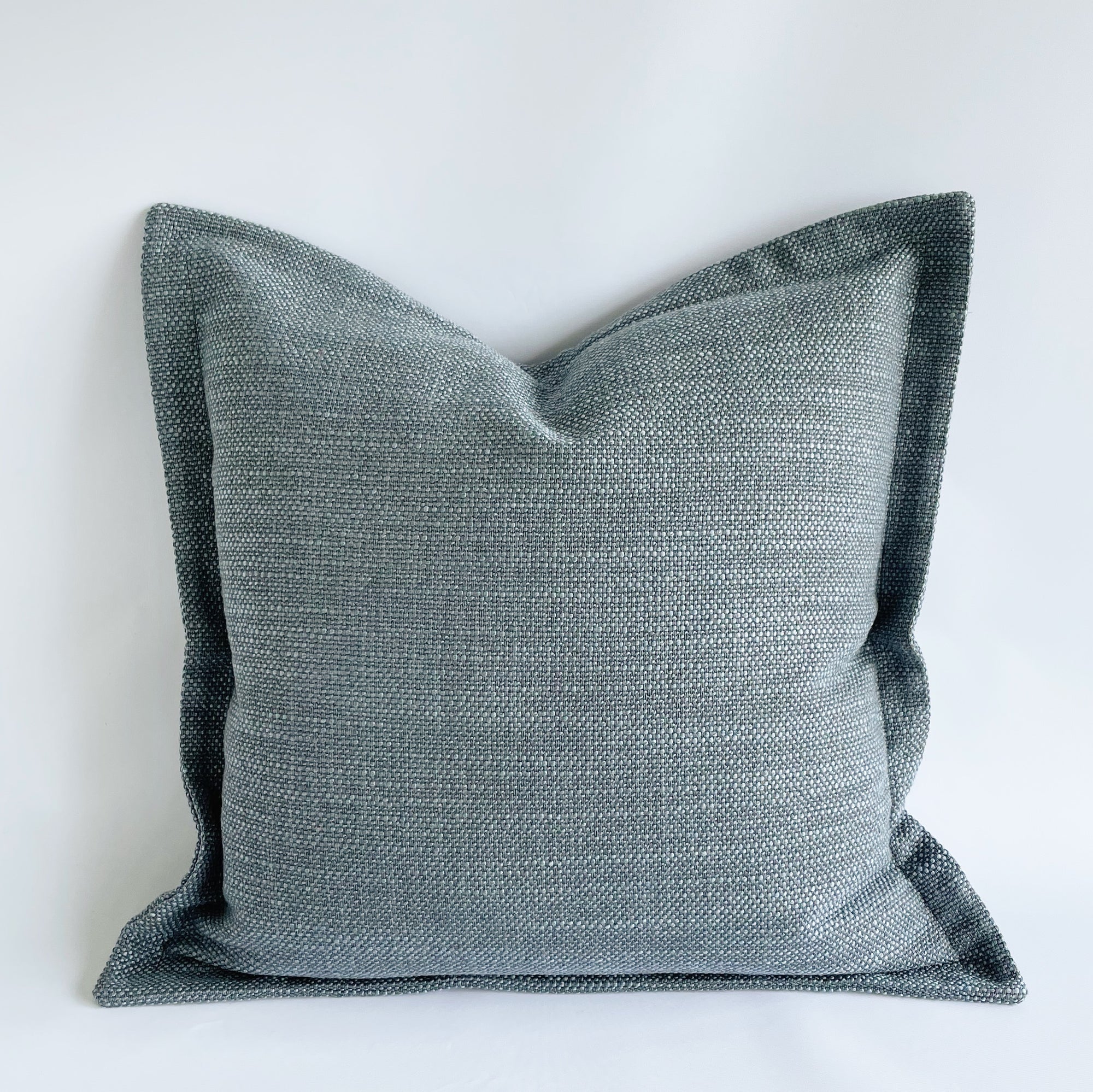 SquareFox textured blue cushion with flange edge Peyton Cloud